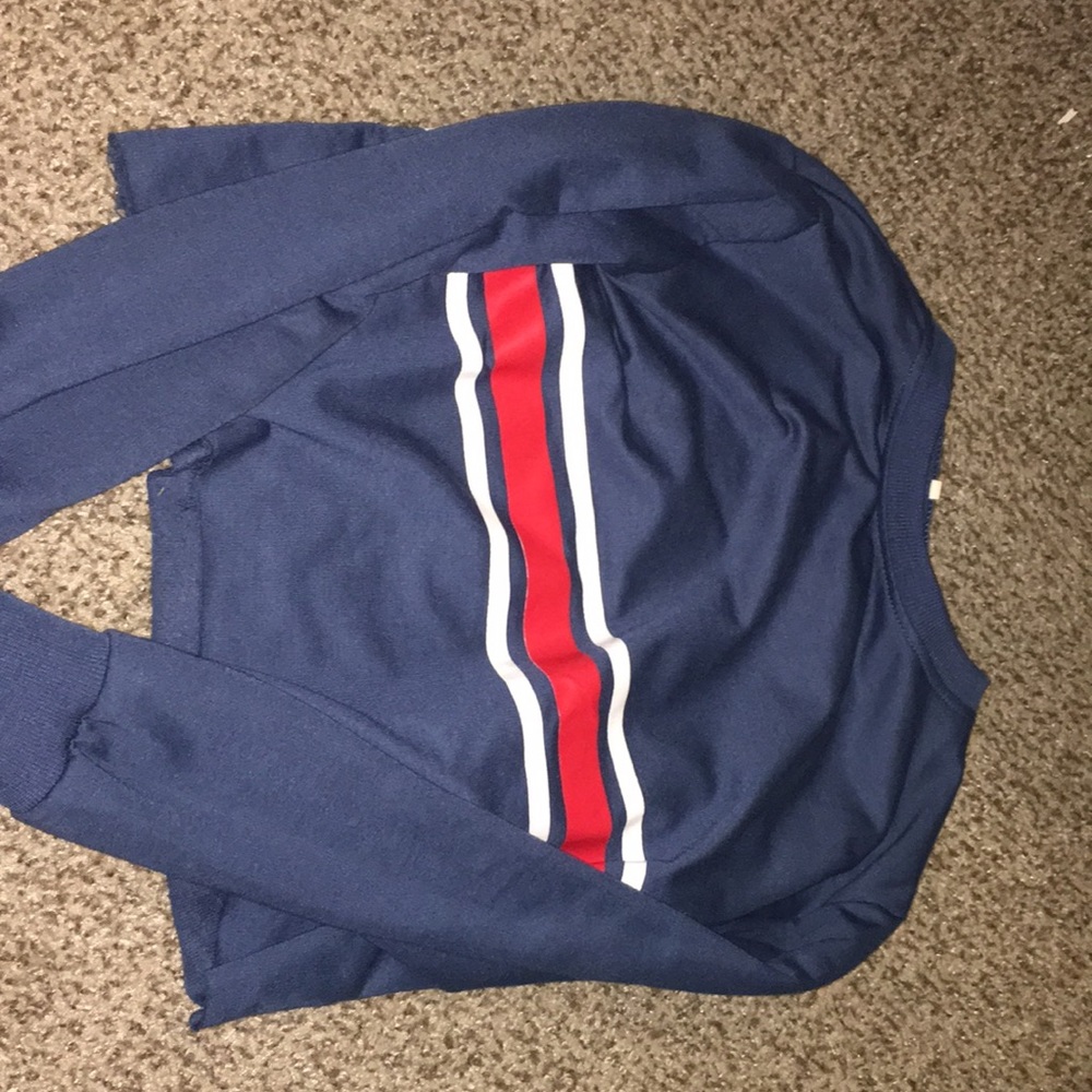 Red & white striped shirt w/ blue background